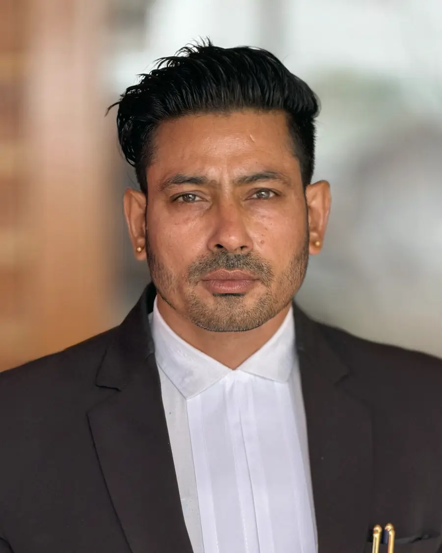 An advocate in a black coat and white collar